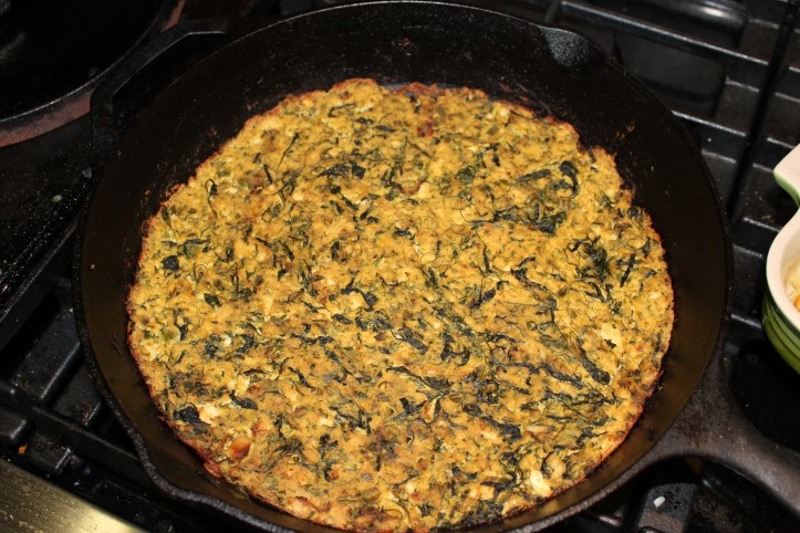 Arugula and Dill Frittata baked in a cast iron pan