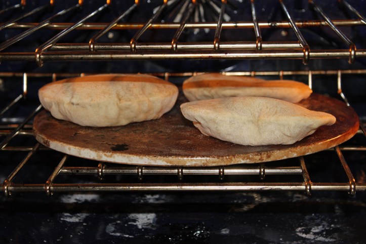 Pita in the oven on a pizza stone